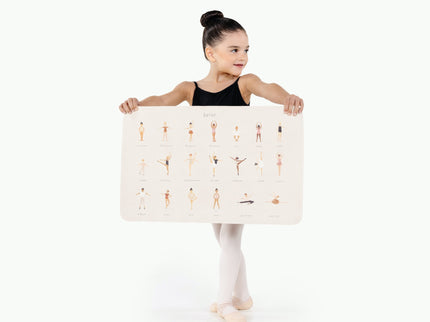 Image of a small girl in ballerina attire holding a mat
