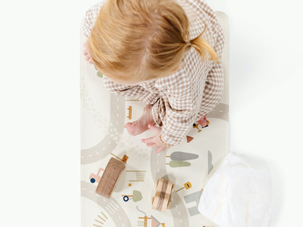 image of a baby sitting in a mat