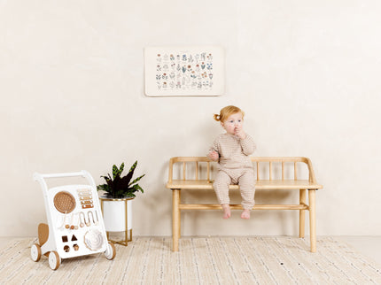 image of a baby sitting on a bench