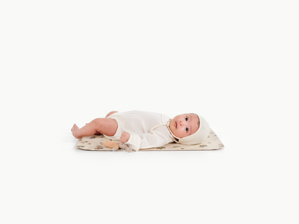 Image of a baby in a padded mat