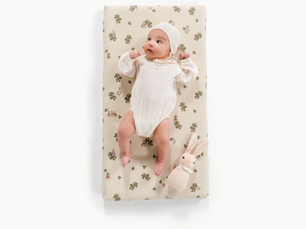 Image of a baby in padded mat