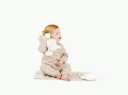 image of a baby sitting in a mat