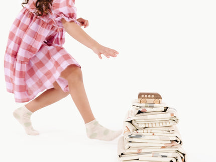 image of a baby playing with a toy in a stacked mat