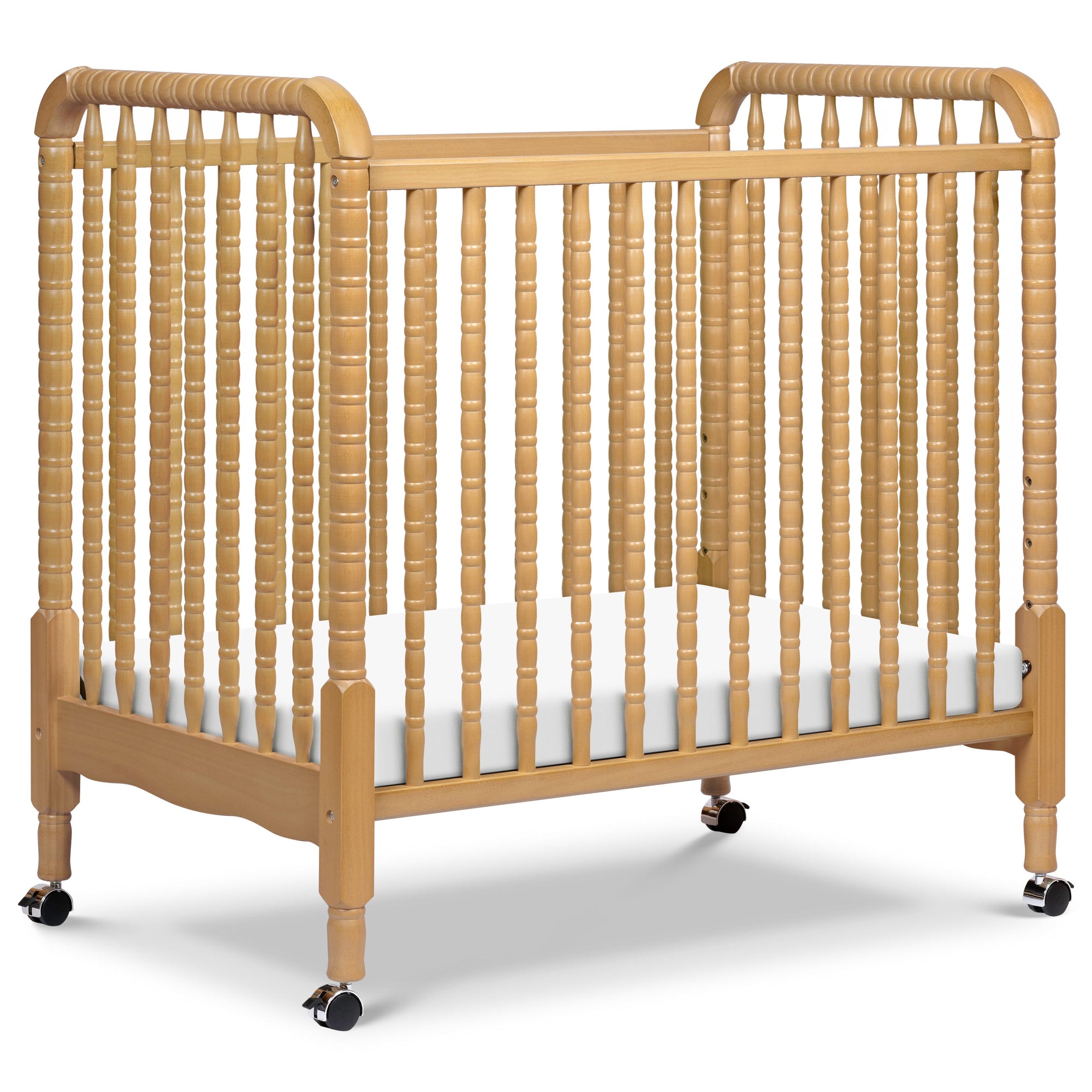 M7398HY,DaVinci,Jenny Lind 3-in-1 Convertible Mini Crib in Honey