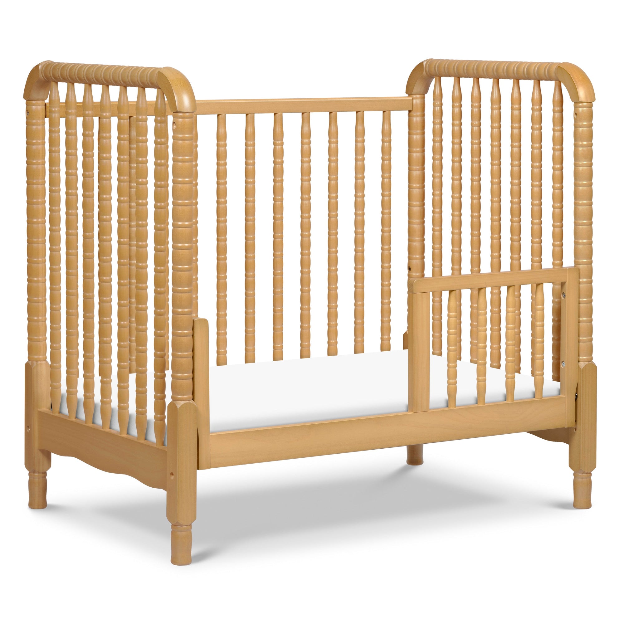 M7398HY,DaVinci,Jenny Lind 3-in-1 Convertible Mini Crib in Honey